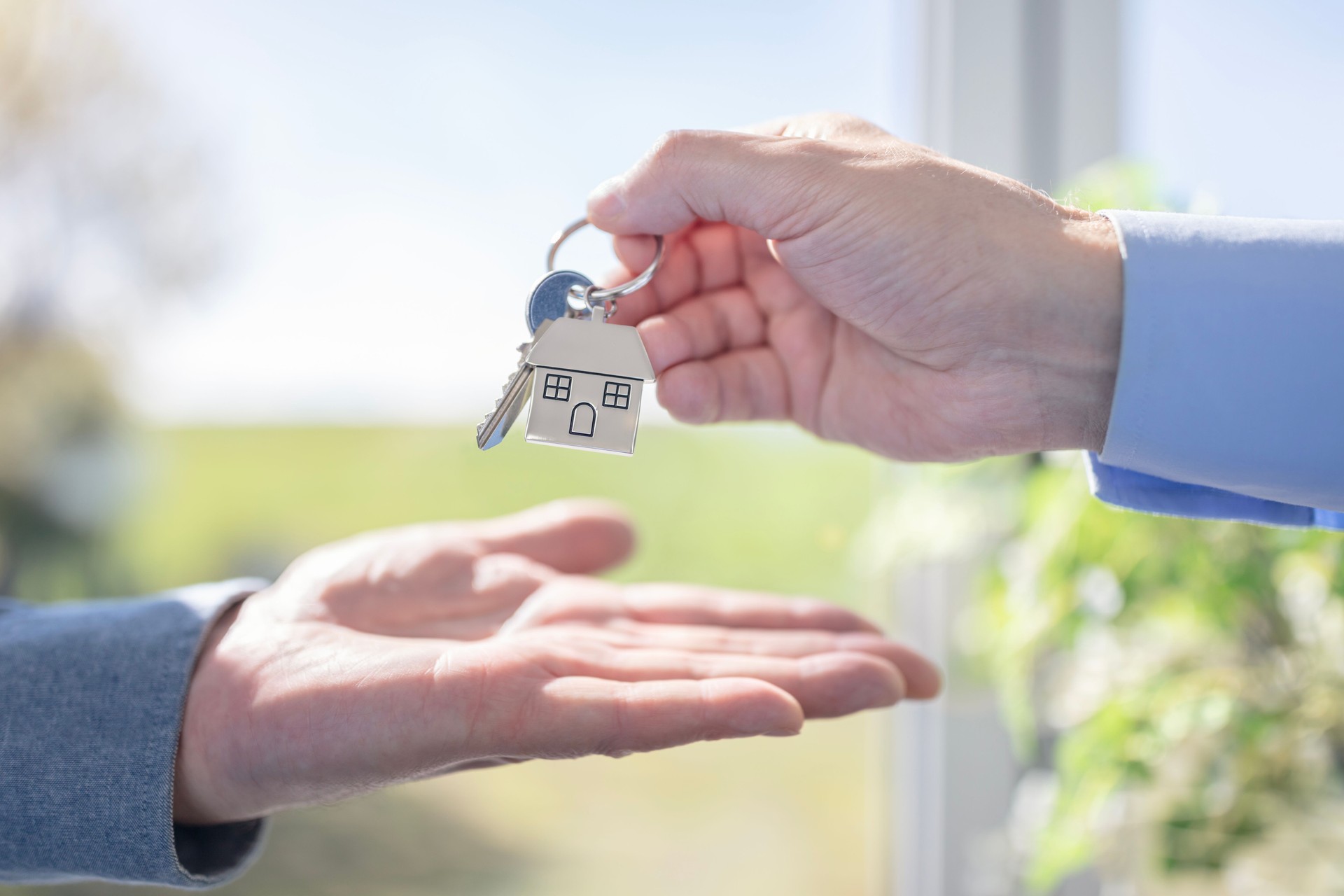 Real estate agent property real estate agent or landlord giving house keys